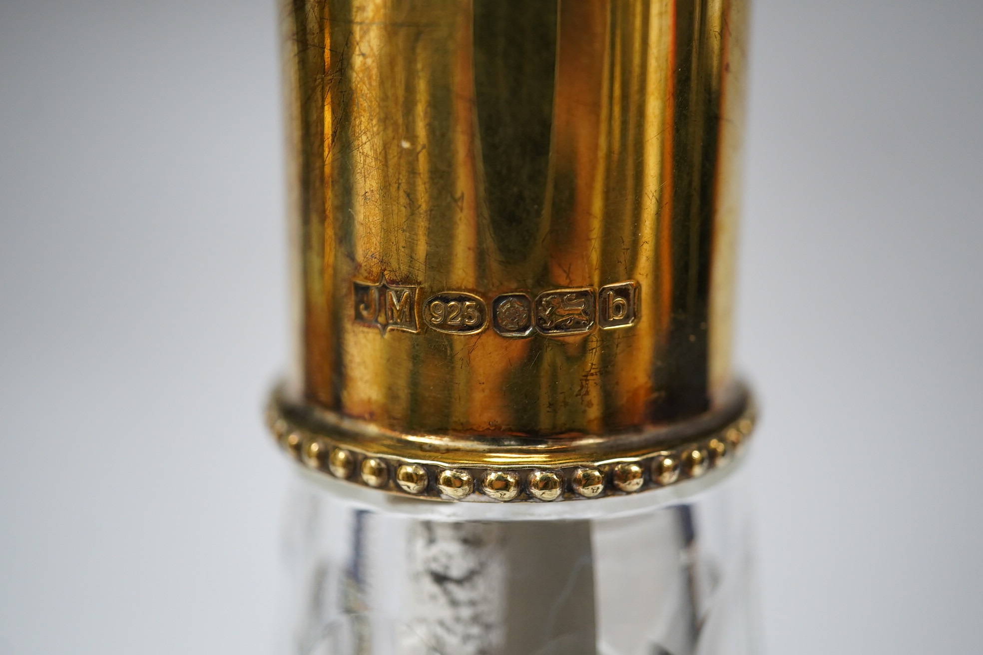 A modern silver gilt mounted cut glass pyriform claret jug, maker JM, Sheffield, 2001, 31.2cm. Condition - good